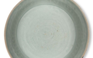 A Chinese porcelain Qingbai bowl, Song dynasty, the cavetto moulded with a band of petals, the pale blue glaze covering all surfaces except the rim and base, 17.6cm diameter