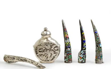 A Chinese silver snuff bottle and four nail guards Republic period The...