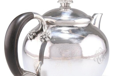 A DANISH STERLING SILVER TEAPOT, CIRCA 1930, by Georg