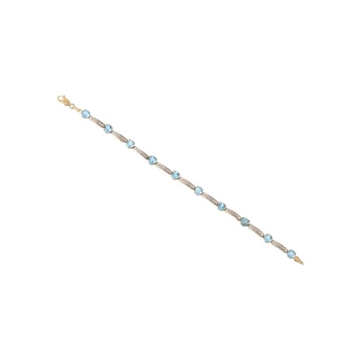 A DIAMOND AND TOPAZ BRACELET, mounted in 10ct gold