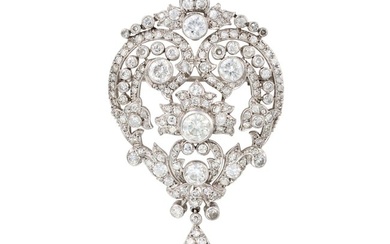 A DIAMOND BROOCH / PENDANT the scrolling foliate body set throughout with round brilliant, transi...