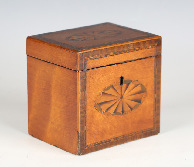 A George III satinwood tea caddy with tulipwood crossbanding and inlaid fan paterae, width 12cm.