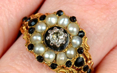 A Georgian 18ct gold black garnet, split pearl and old-cut diamond mourning ring, with floral shoulders.