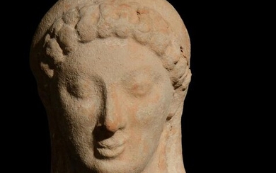A Greek Terracotta Head Height 4 inches.