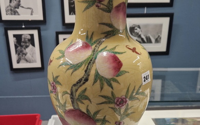 A LARGE ORIENTAL VASE WITH YELLOW GROUND AND FRUIT TREE DECORATION- LATER MOUNTED AS A LAMP.