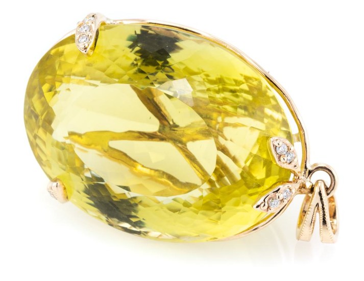 A LEMON QUARTZ AND DIAMOND PENDANT; featuring an approx. 60ct fancy oval cut lemon quartz with 2 claws and leaf surmount set with 8...