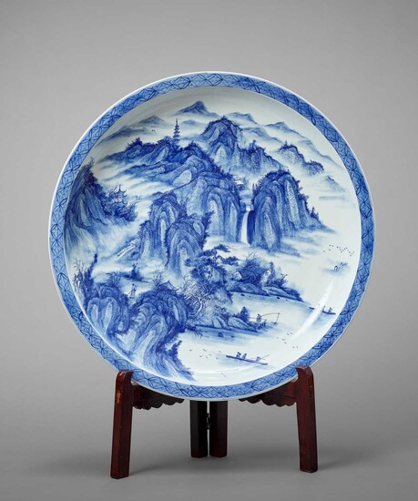 A MONUMENTAL ARITA PORCELAIN CHARGER WITH A MOUNTAIN LANDSCAPE