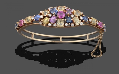 A Multi-Gemstone Cluster Bangle, the cluster set throughout with vari-shaped...