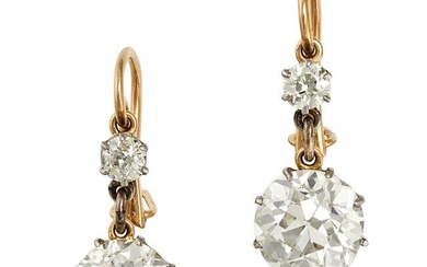 A PAIR OF ANTIQUE DIAMOND DROP EARRINGS in yellow gold, each set with an old European cut diamond