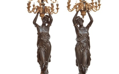 A PAIR OF BELLE EPOQUE STYLE PATINATED AND GILT BRONZE FIGURAL TORCHÃˆRES