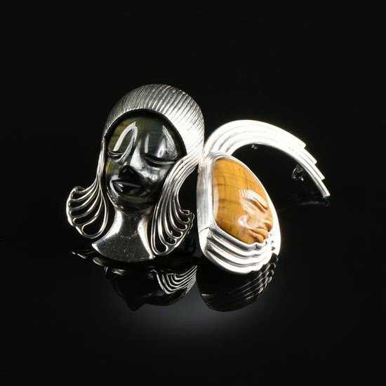 A PAIR OF MEXICAN STERLING SILVER AND TIGER'S EYE MASK