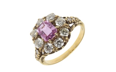 A PINK SAPPHIRE AND DIAMOND CLUSTER RING. mounted with an oc...