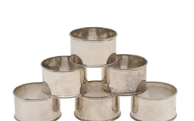 A SET OF SIX 925 SILVER NAPKIN RINGS.