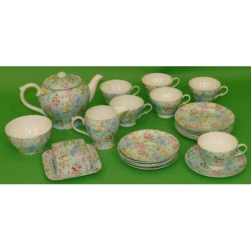 A Shelley "Melody" Pattern Tea Service on green ground with ...