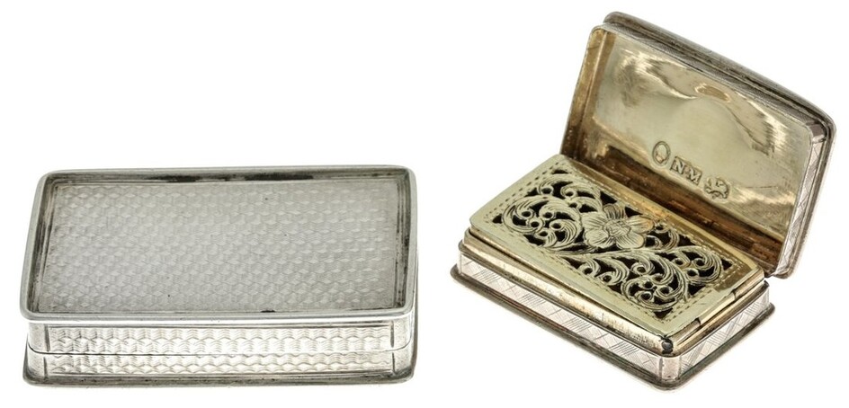 A Silver Snuff Box and Silver Vinaigrette The snuff box with engine turned decoration and vaca...