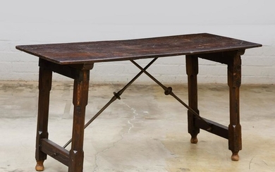 A Spanish Baroque style iron & wood library table