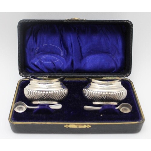 A cased pair of Edwardian silver salts, oval fluted form, Bi...