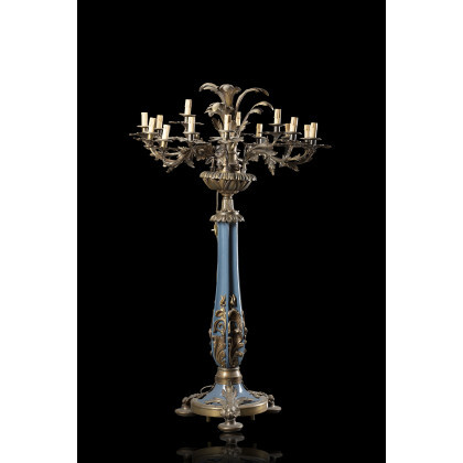 A cast iron and bronze eighteen-light candle holder decorated with plant motifs. Lacquered metal column with floral mounts (h. cm...
