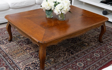 A cherry wood coffee table in the French taste, raised on short cabriole legs, Height 40cm x 120cm x 90cm