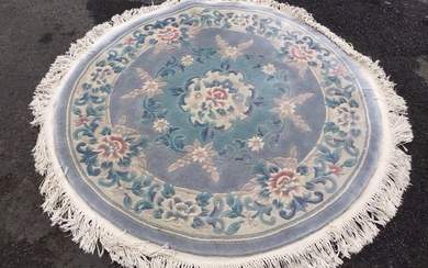 A circular Kayam Chinese wool rug with a central floral...