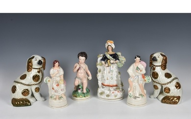A collection of Staffordshire Pottery figures, to include a ...