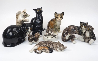 A collection of Winstanley pottery cats, to include an ashtray modelled as a cat sitting by a campfire, 12.5cm diameter, a sleeping cat group, 30cm long, and eight cats with glass eyes, tallest 24cm high (10)