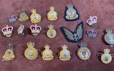 A collection of military badges, archery badges and badges from...