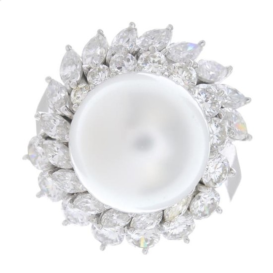 A cultured pearl and diamond cluster ring. The cultured