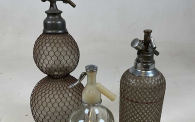 A double gourd soda syphon with mesh cage and two...