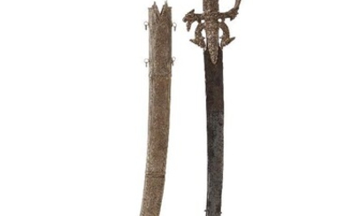 A gem-set silver and gold Singhalese steel sword (kastane) and scabbard, Sri Lanka, 17th century, 60cm. high This kast?né (A Sinhalese sword with a short curved blade) is a ceremonial sword, part of the official dress of Sinhalese who served the...