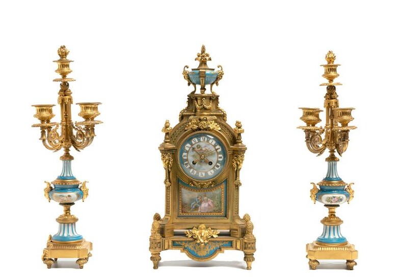 A gilt-bronze and porcelain mantel clock and garniture
