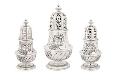 A graduated set of three early George II sterling silver casters, London 1727 by George Wickes