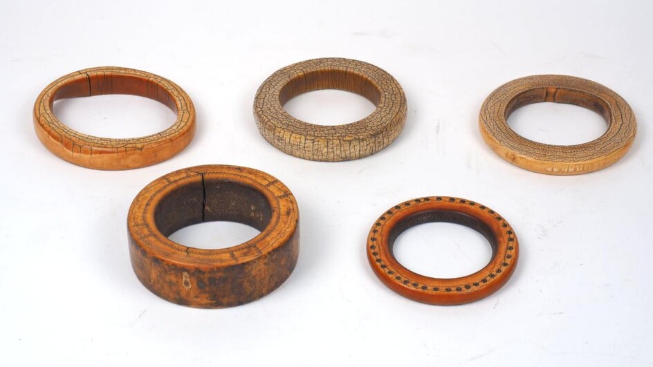 A group of mixed African ivory, 19th century, to include children's bangles, rings, beads and game pieces, of varying decoration and patina, (a lot)