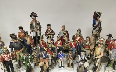 A large collection of porcelain soldier figures of various d...