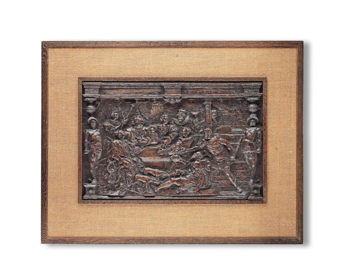A late 16th century carved oak panel, German, Lazarus at the Rich Man's Gate from The Parable of Lazarus and Dives