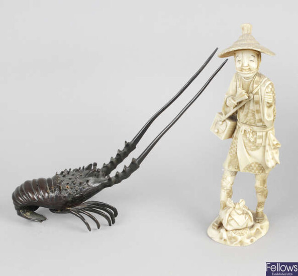 A late 19th century carved ivory okimono modelled as a male in traditional dress, together with a bronze modelled as a crayfish, etc.