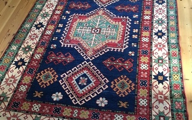 A late 20th century carpet in classical Caucasian Kazak design. 147×229 cm.