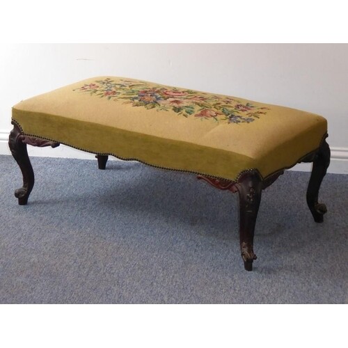 A mid-19th century upholstered long stool; a later floral ne...
