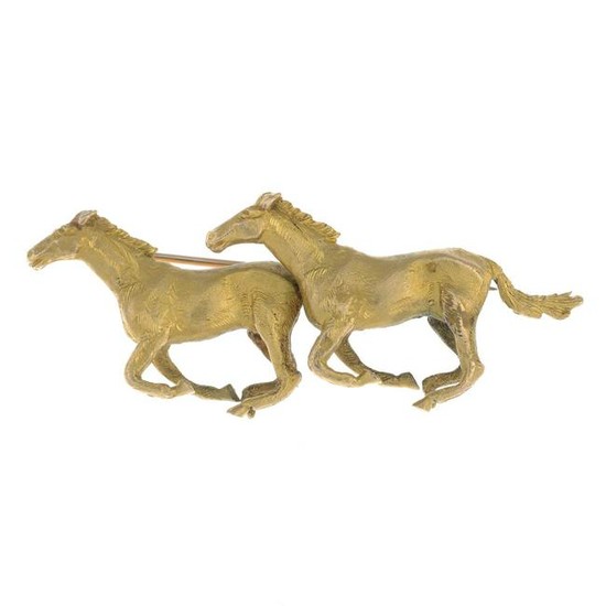A mid 20th century 9ct gold brooch, depicting galloping