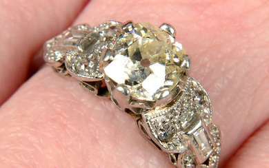 A mid 20th century platinum old-cut diamond single-stone ring, with vari-cut diamond shoulders.