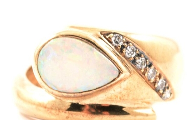 A modern opal and diamond ring, new and boxed.