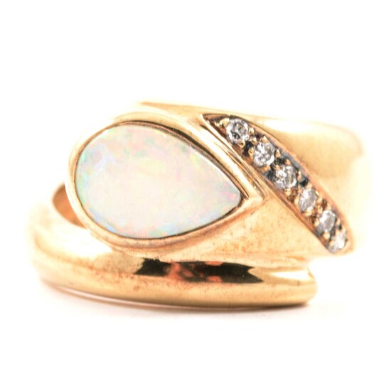 A modern opal and diamond ring, new and boxed.