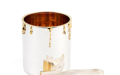 A novelty silver ice bucket and tongs