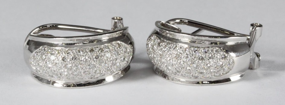 A pair of 18ct white gold half hoop earrings pave set with r...