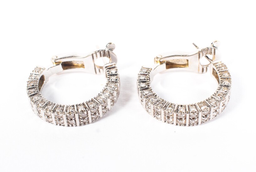 A pair of Boucheron Paris 18ct white gold and diamond hoop earrings