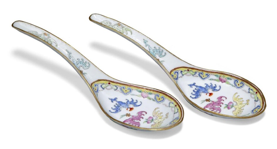 A pair of Chinese porcelain imperial famille rose spoons, Tongzhi mark and of the period, finely painted in different colours with five bats in flight, wufu, holding precious objects in their mouths, lingzhi and wan-character inside a border of...