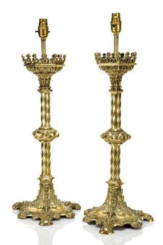 A pair of French polished brass Gothic...