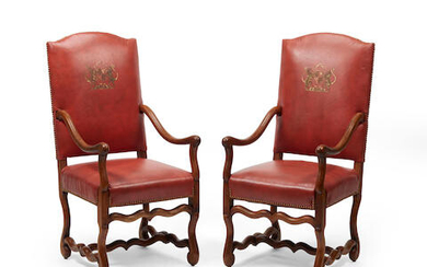 A pair of French provincial walnut fauteuils a la Reine