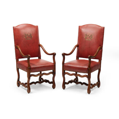 A pair of French provincial walnut fauteuils a la Reine