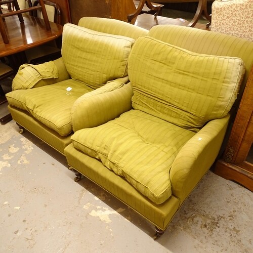 A pair of Howard style upholstered armchairs, on mahogany le...
